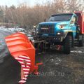 Snow removal truck. Russian dump truck with blade and sand spreader